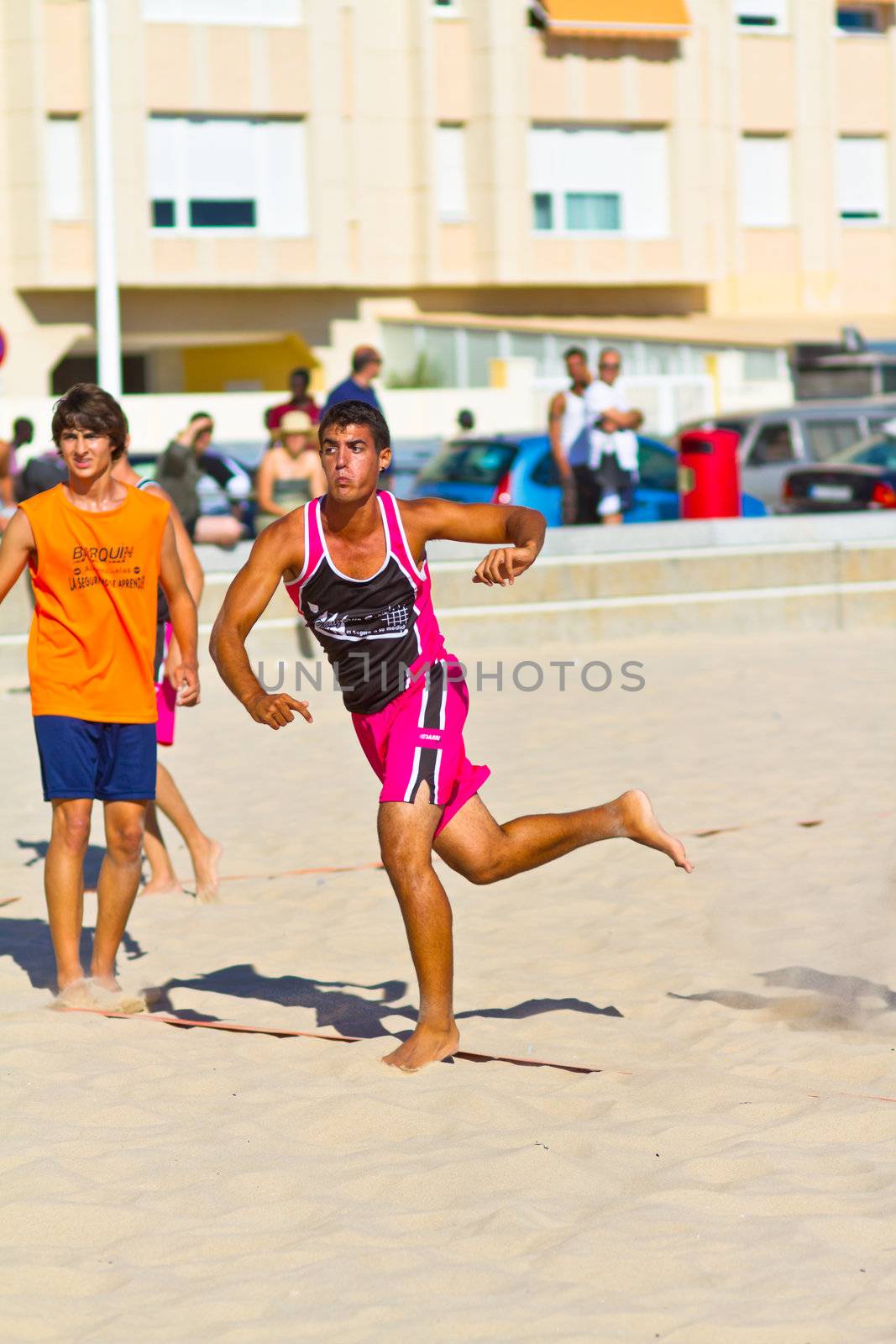 CADIZ, SPAIN - JULY 19: Unidentified players compete in a match between Autoescuela Barquin and CadizSur Seguros BMPY in the 19th league of beach handball of Cadiz on July 19, 2011 in Cadiz, Spain