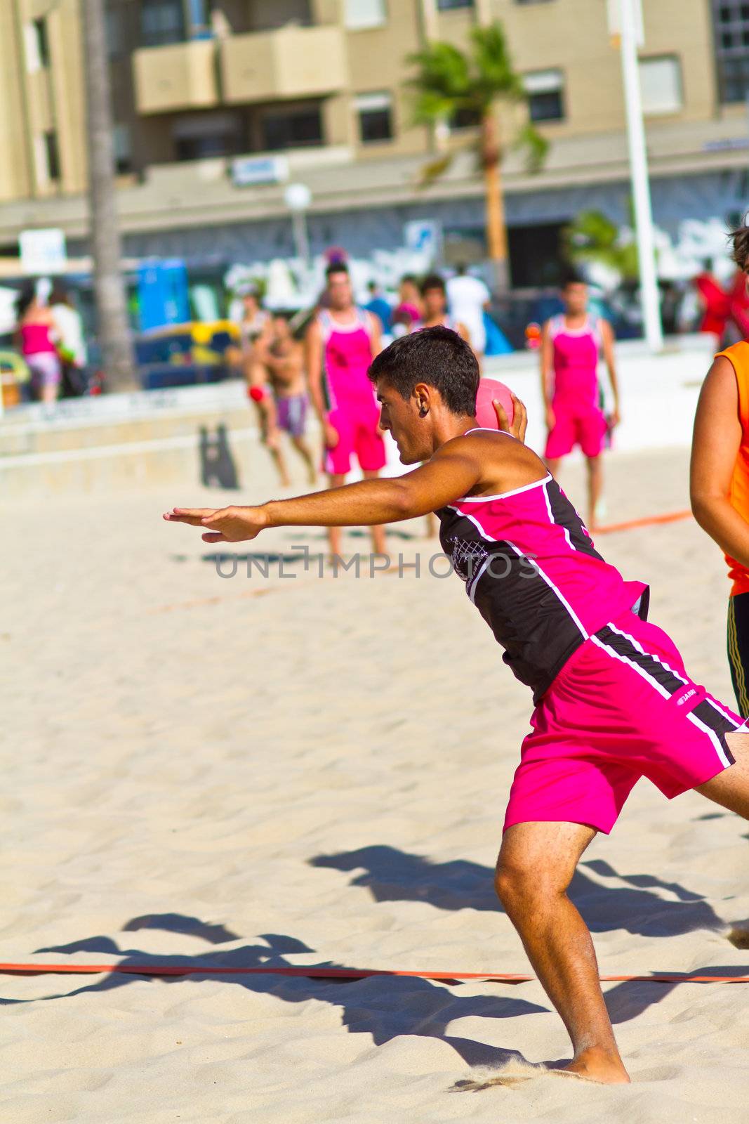 CADIZ, SPAIN - JULY 19: Unidentified players compete in a match between Autoescuela Barquin and CadizSur Seguros BMPY in the 19th league of beach handball of Cadiz on July 19, 2011 in Cadiz, Spain