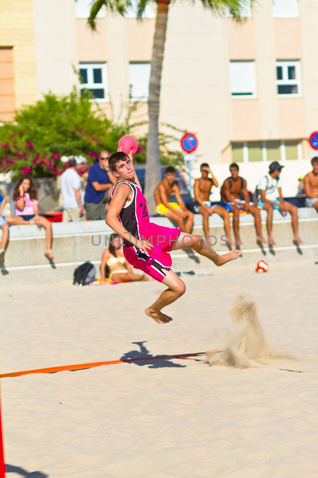 CADIZ, SPAIN - JULY 19: Unidentified players compete in a match between Autoescuela Barquin and CadizSur Seguros BMPY in the 19th league of beach handball of Cadiz on July 19, 2011 in Cadiz, Spain