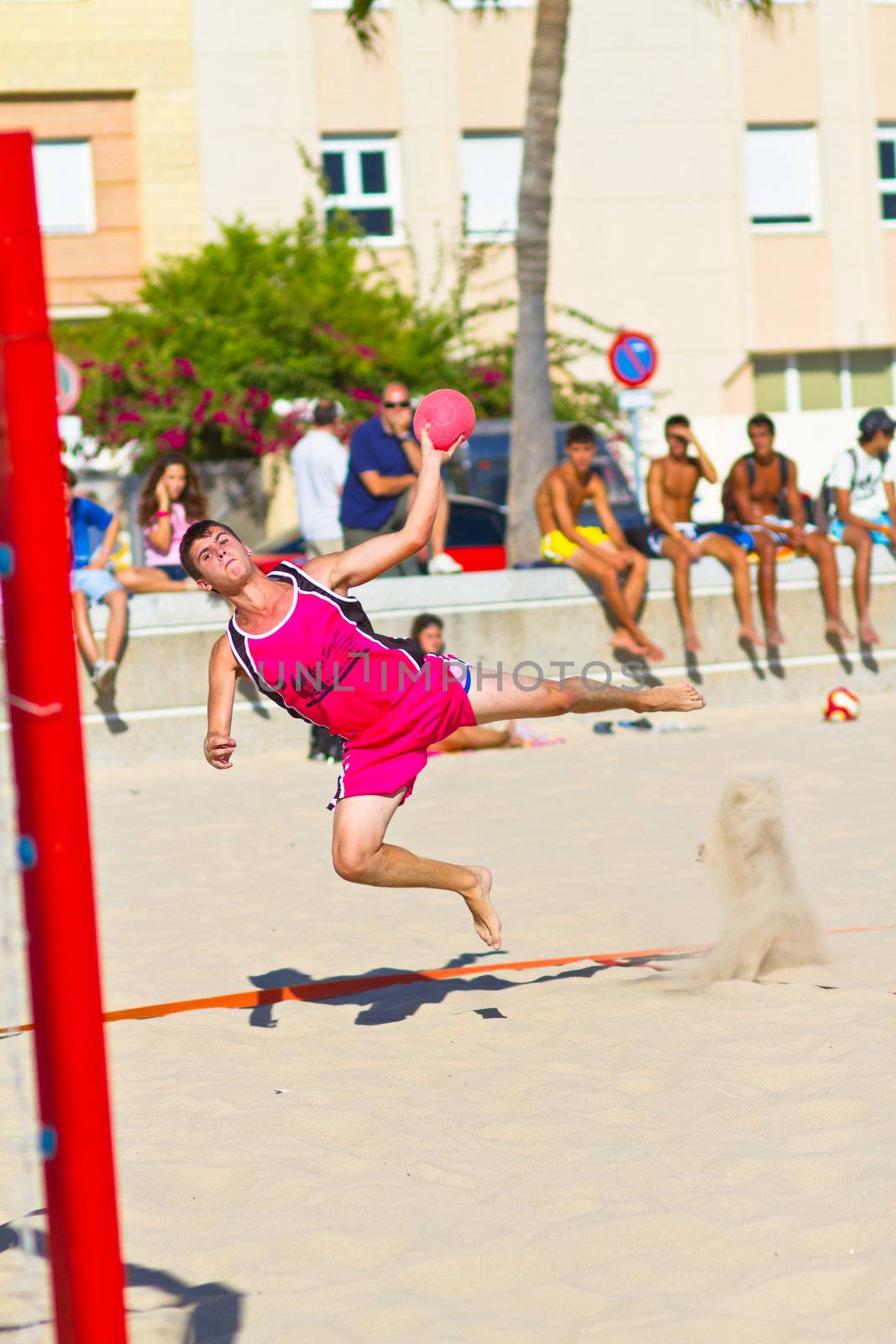 CADIZ, SPAIN - JULY 19: Unidentified players compete in a match between Autoescuela Barquin and CadizSur Seguros BMPY in the 19th league of beach handball of Cadiz on July 19, 2011 in Cadiz, Spain