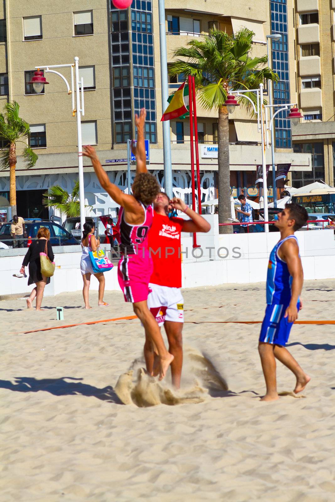 CADIZ, SPAIN - JULY 19: Unidentified players compete in a match between Autoescuela Barquin and CadizSur Seguros BMPY in the 19th league of beach handball of Cadiz on July 19, 2011 in Cadiz, Spain