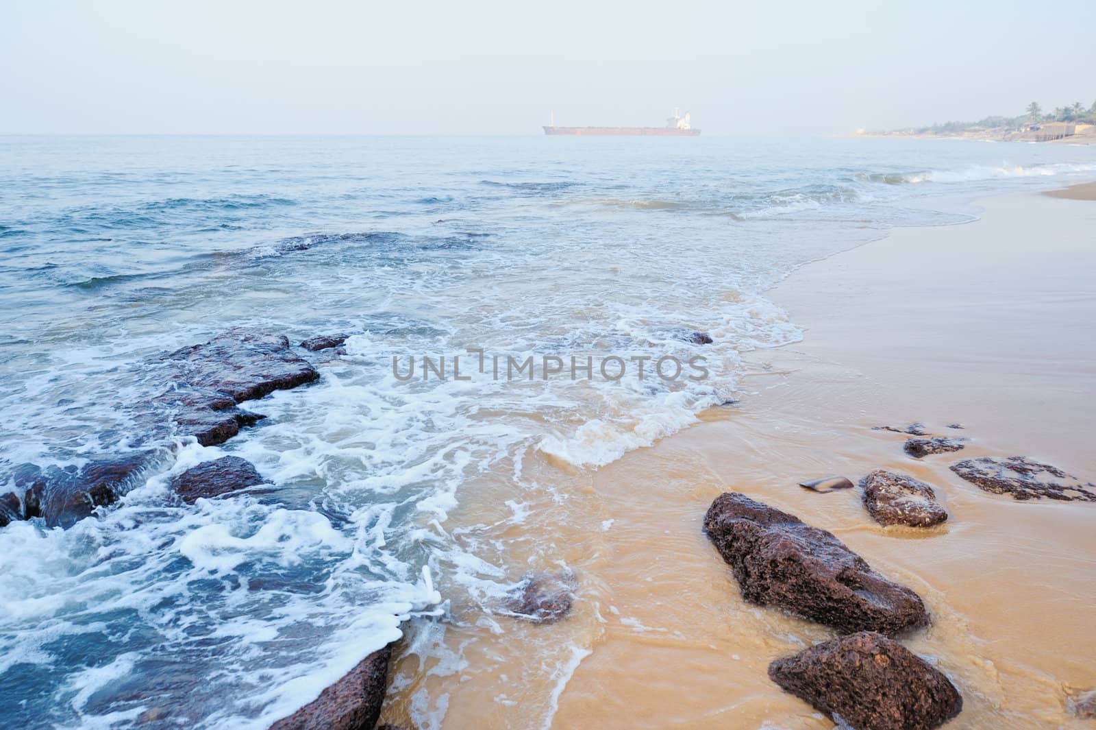 Smooth wave on the sandy beach in the morning