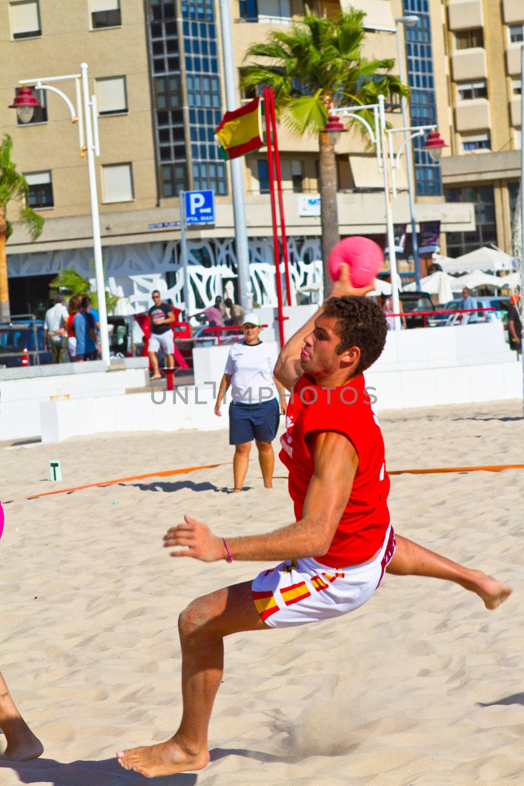 CADIZ, SPAIN - JULY 19: Unidentified players compete in a match between Autoescuela Barquin and CadizSur Seguros BMPY in the 19th league of beach handball of Cadiz on July 19, 2011 in Cadiz, Spain