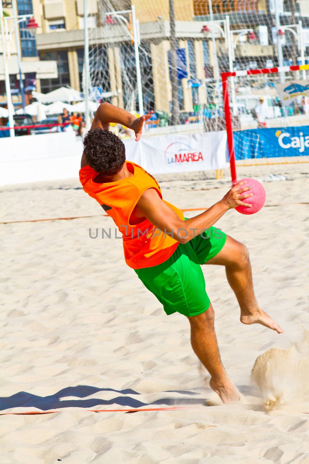 CADIZ, SPAIN - JULY 19: Unidentified players compete in a match between Autoescuela Barquin and CadizSur Seguros BMPY in the 19th league of beach handball of Cadiz on July 19, 2011 in Cadiz, Spain