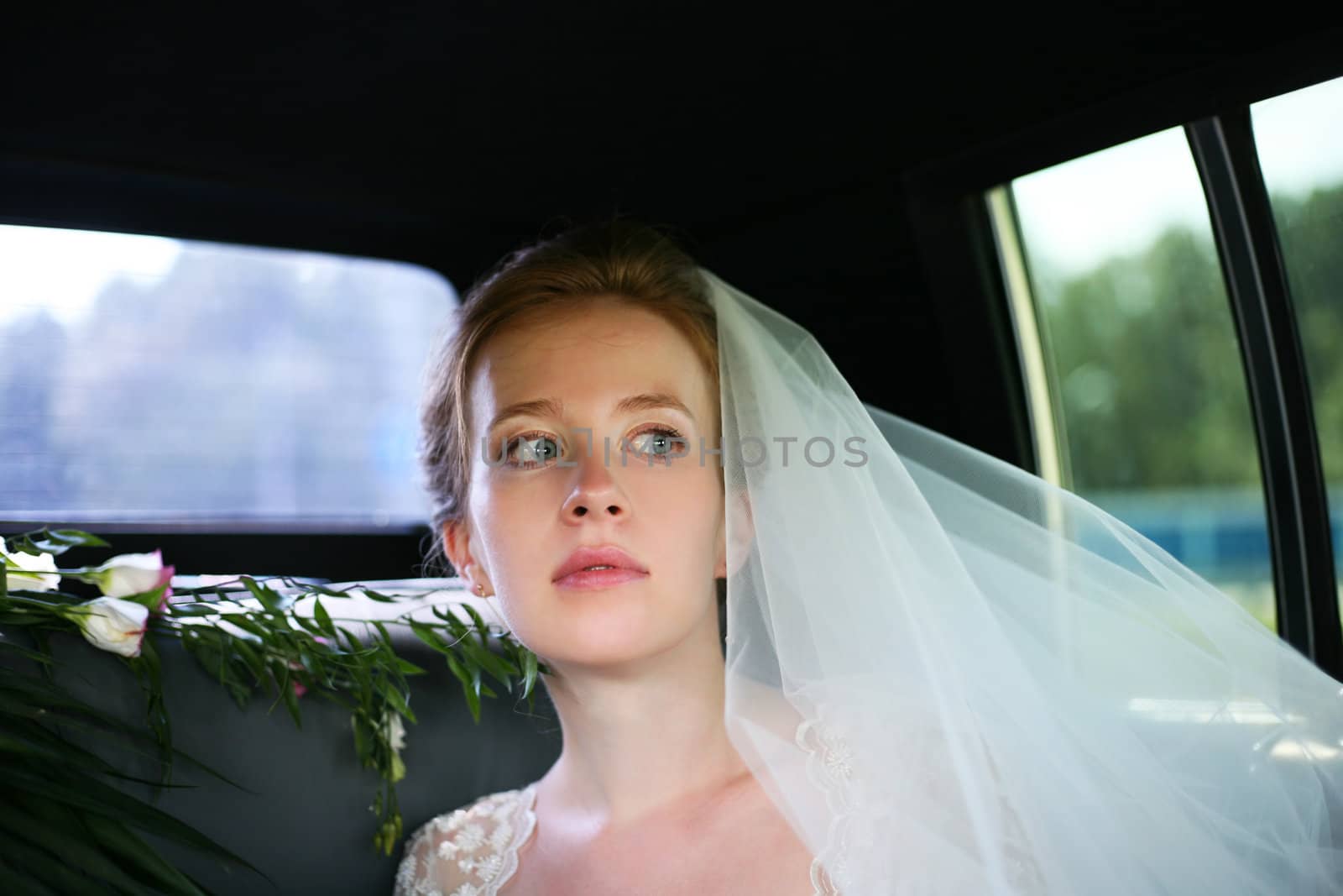 Beautiful the bride in car