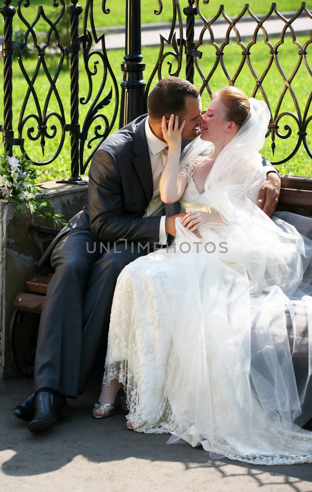 Beautiful the bride and the groom kiss