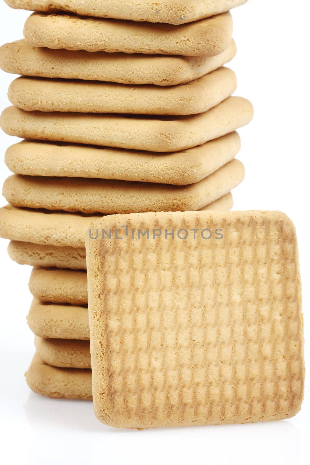 Stack of cookies close up over white 