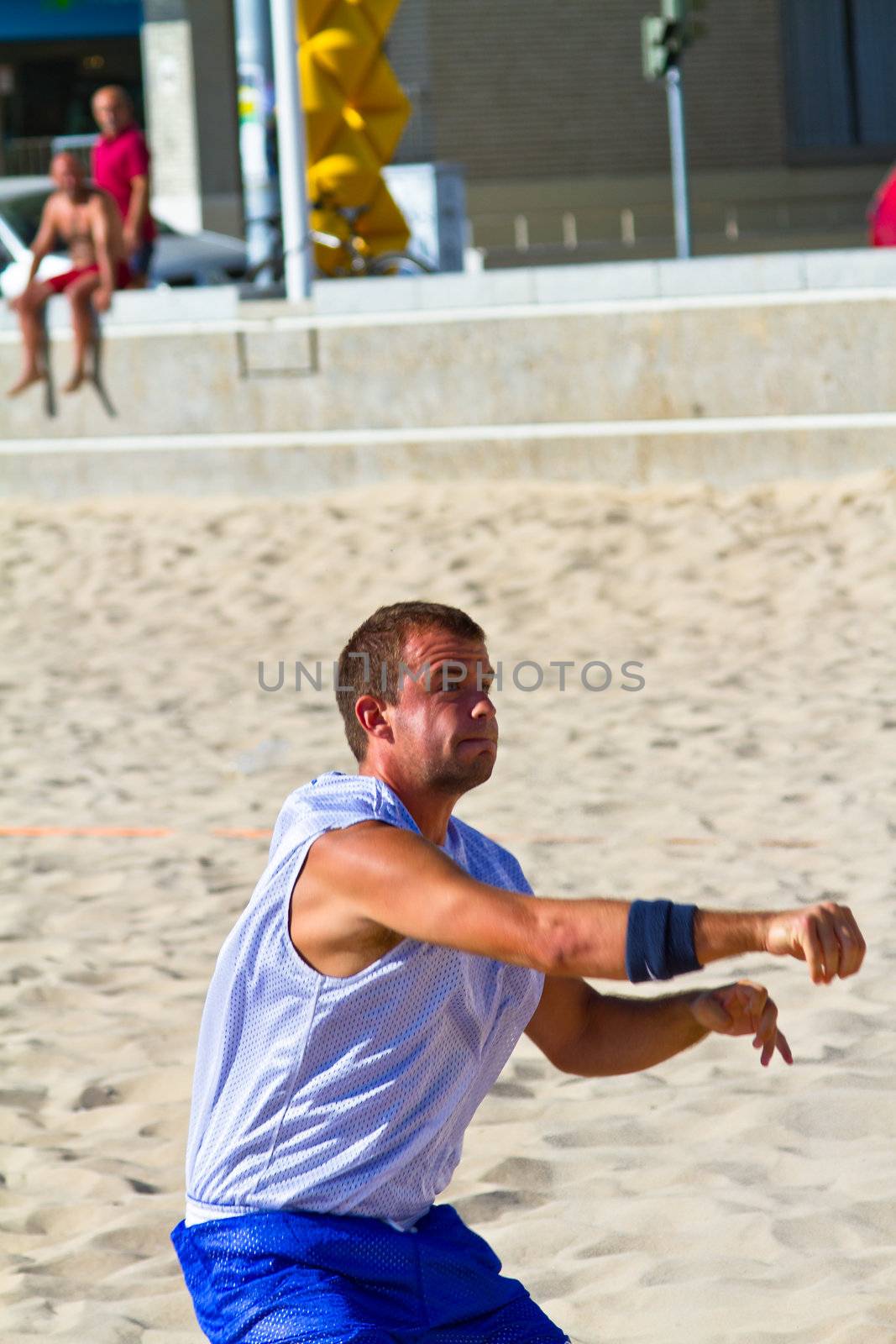 CADIZ, SPAIN - JULY 19: Unidentified players compete in a match between Los Negritos and Ademar Adentro in the 19th league of beach handball of Cadiz on July 19, 2011 in Cadiz, Spain