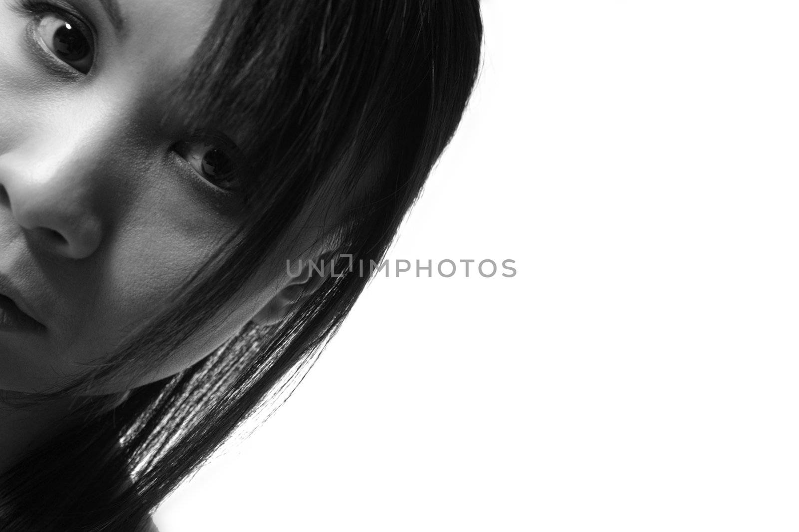 Studio portrait of a asian girl looking curious
