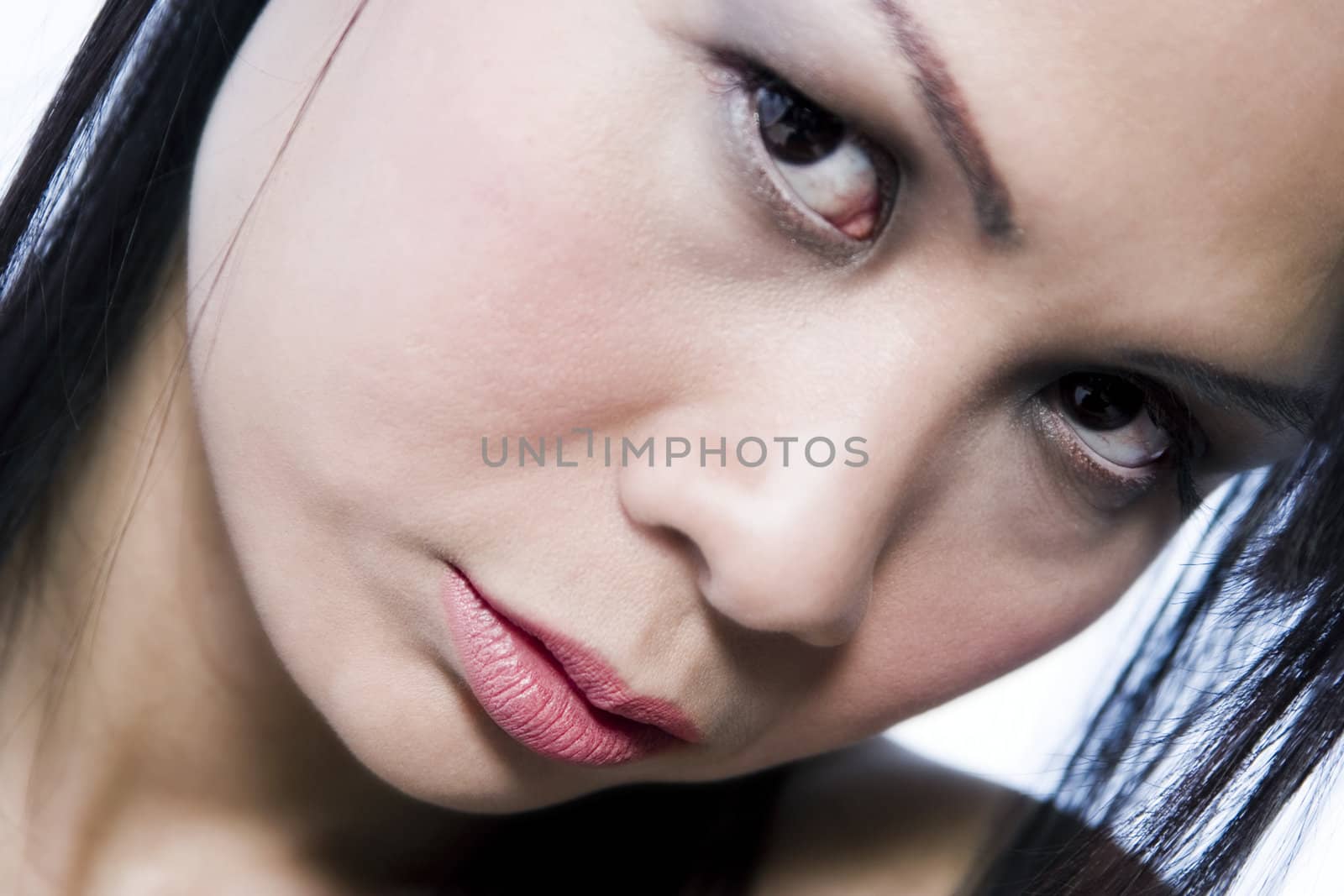 Studio portrait of a asian girl looking down