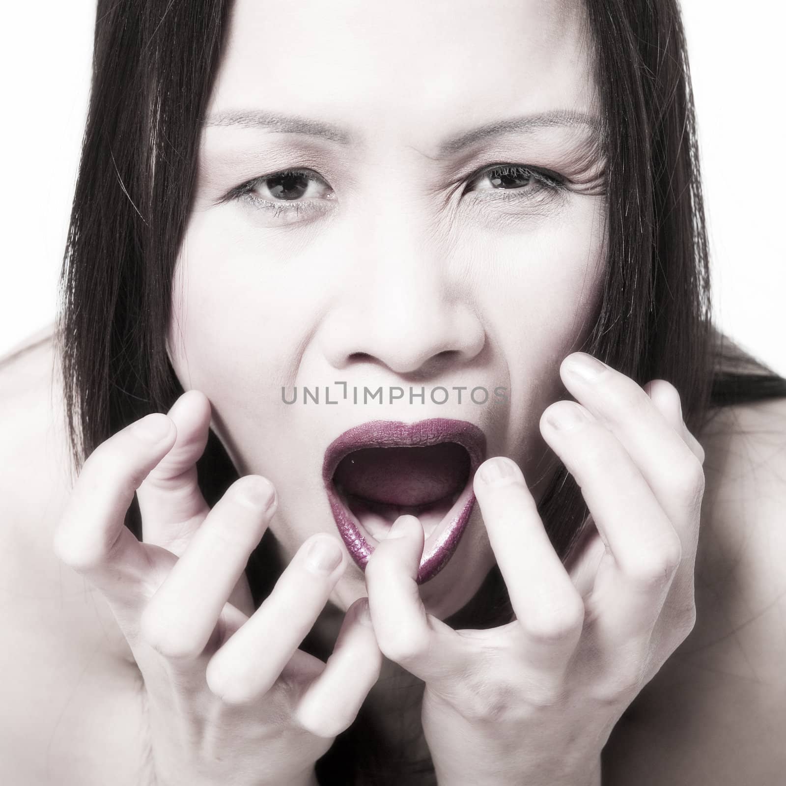 Studio portrait of a asian girl looking really scared