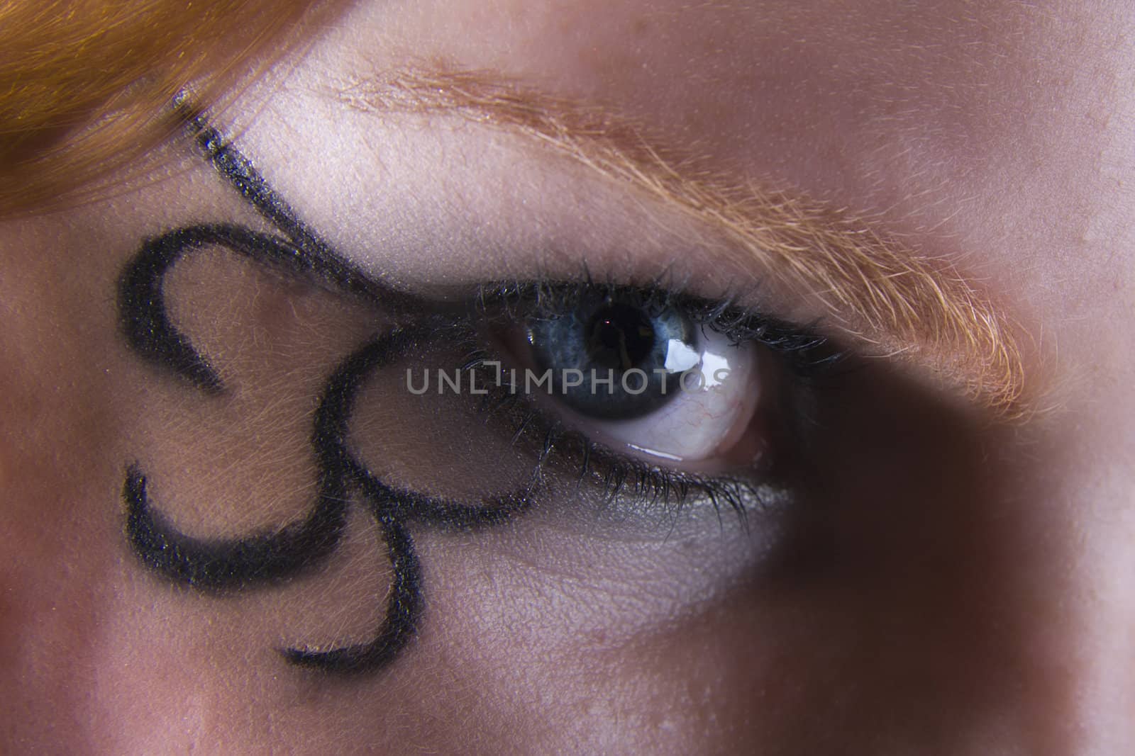 Studio portrait of natural red haired eye and eyelash