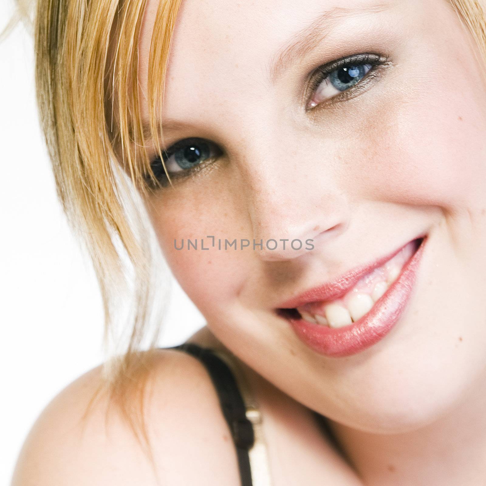 Studio portrait of a curly blond female