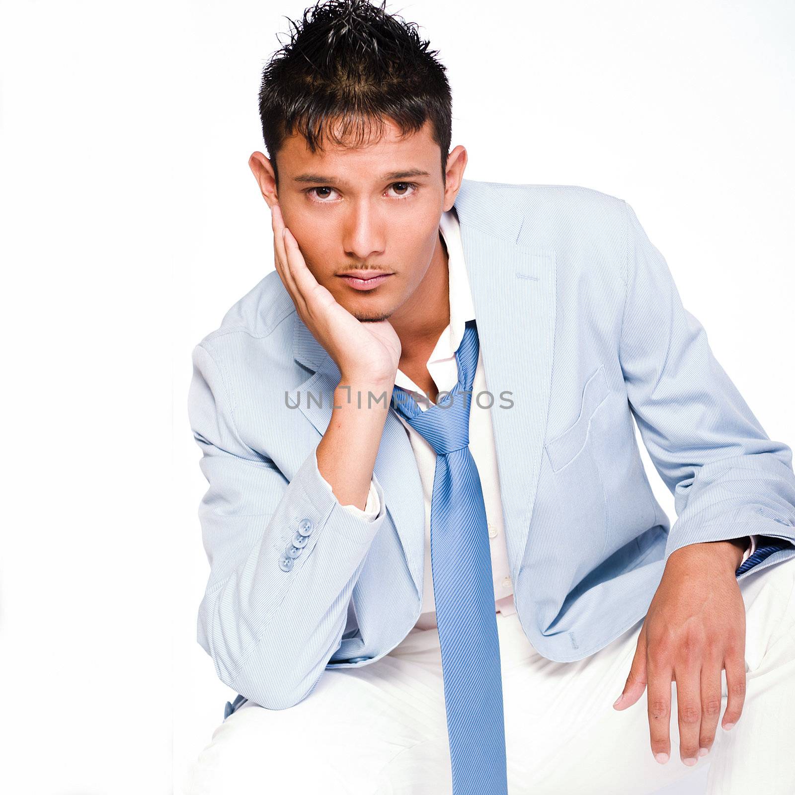 Studio portrait of mixed race young man in thoughts