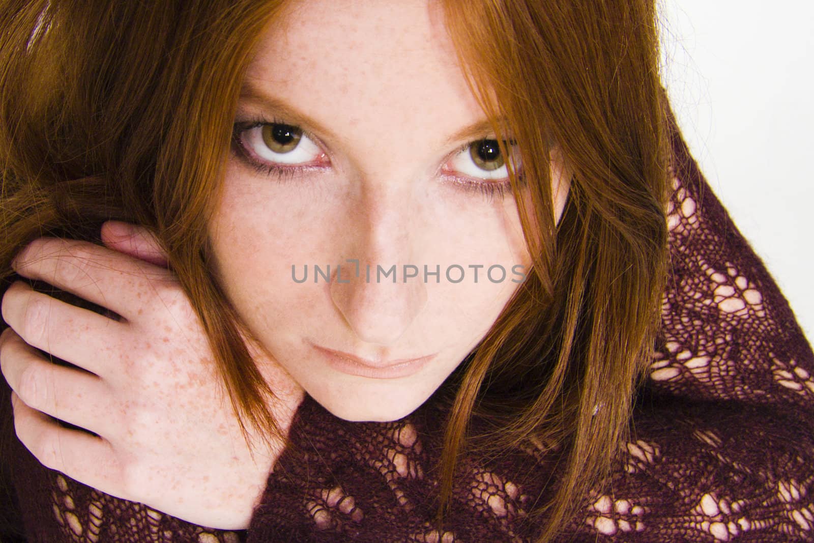 Studio portrait of a natural redhead feeling depressed