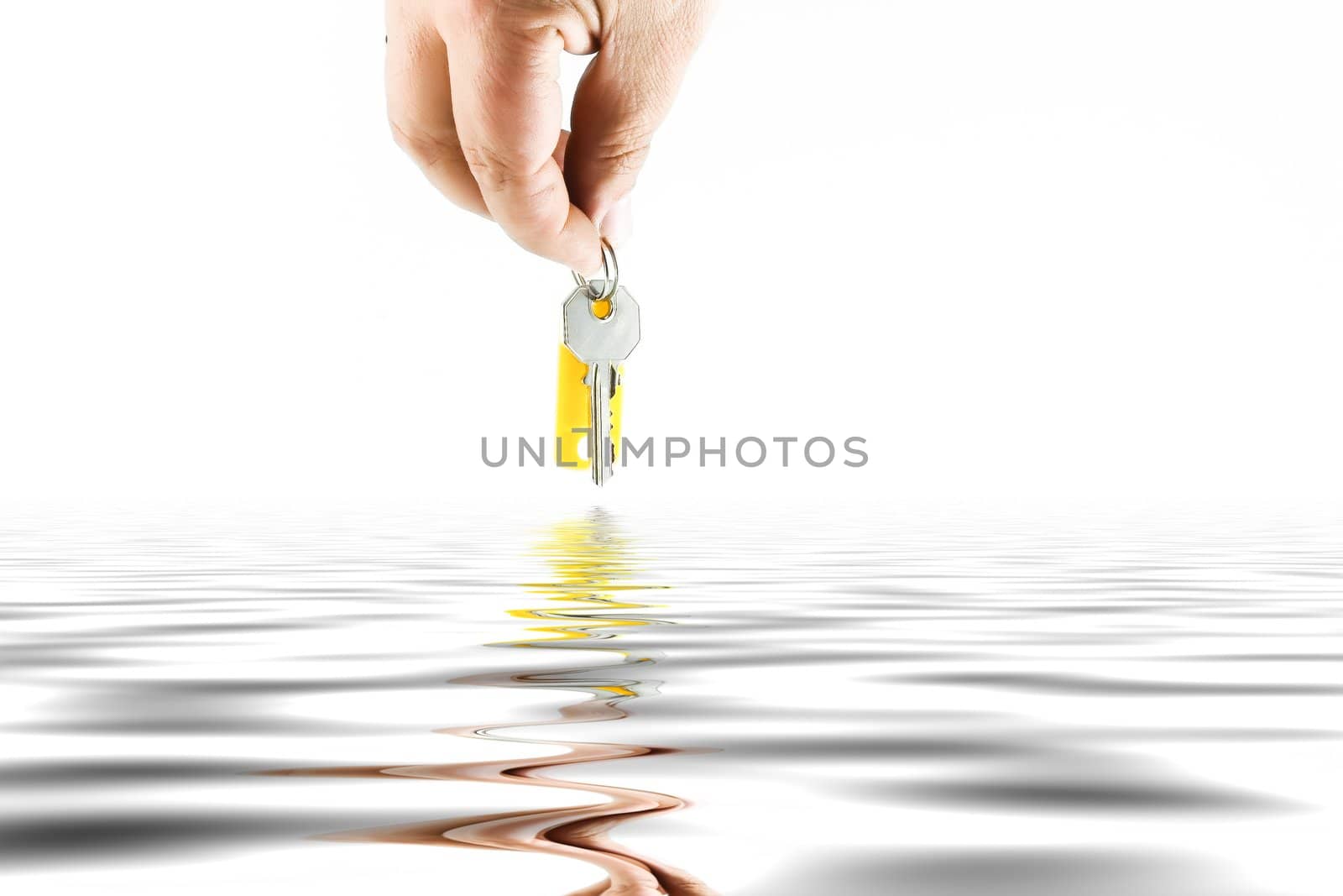 Hand with key  with blank tag on white background. Isolated object.