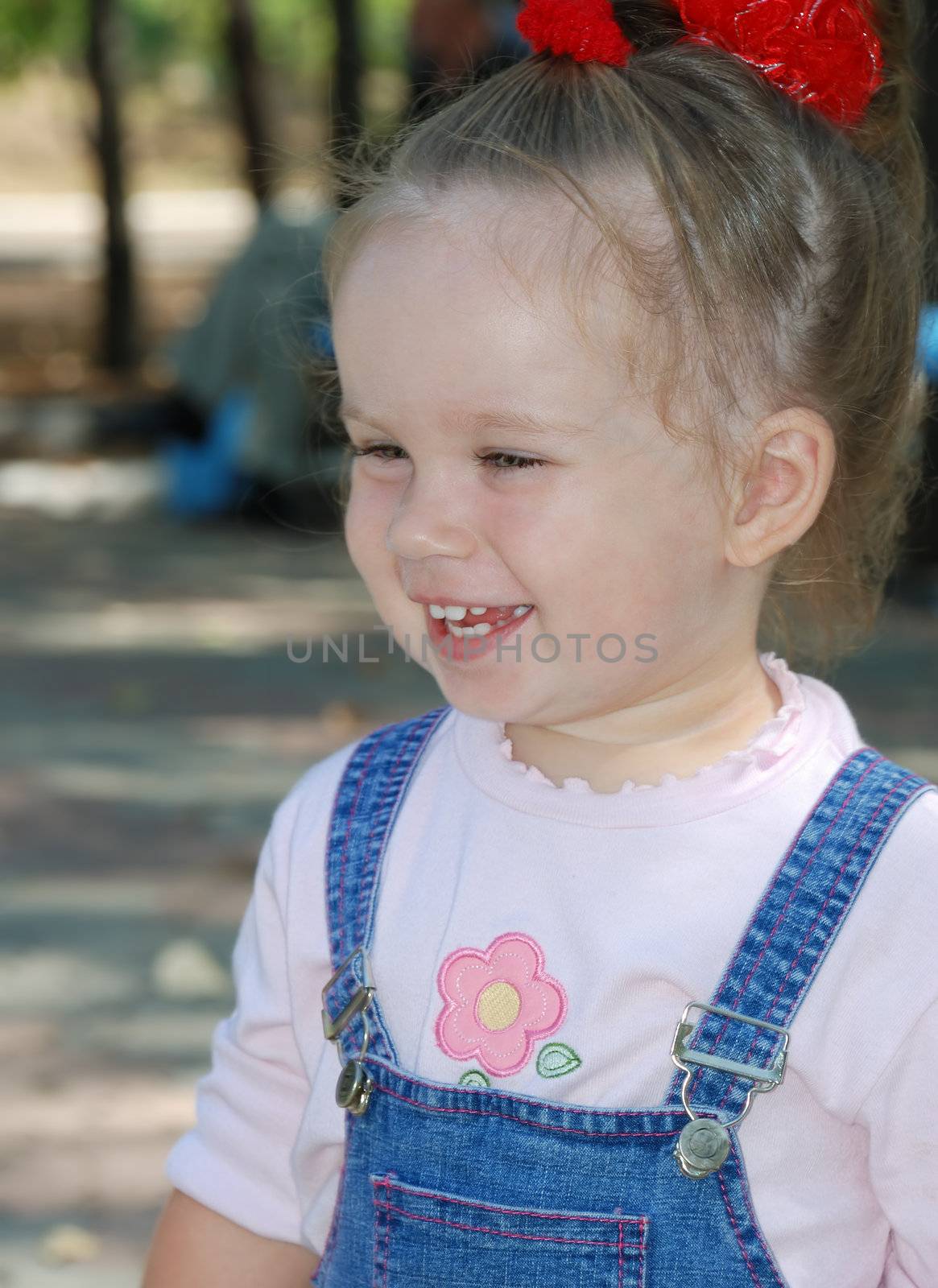 Small laughing the girl. Age - 2 years