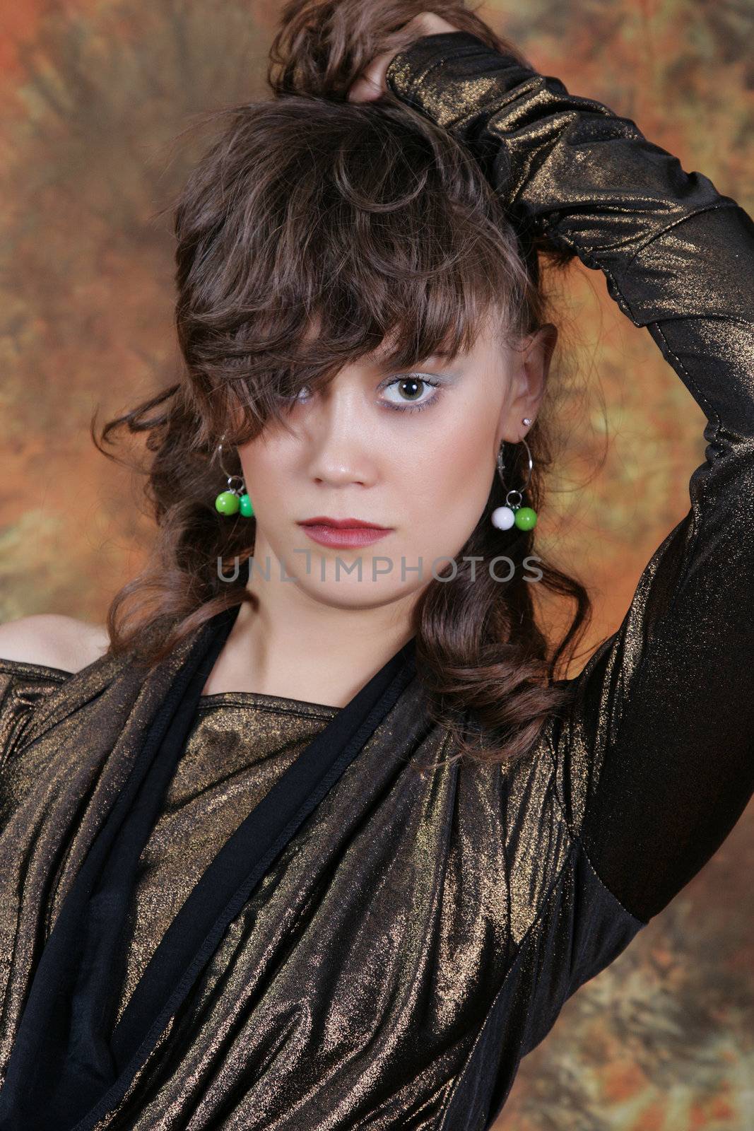 Portrait of the beautiful woman in studio looking forward