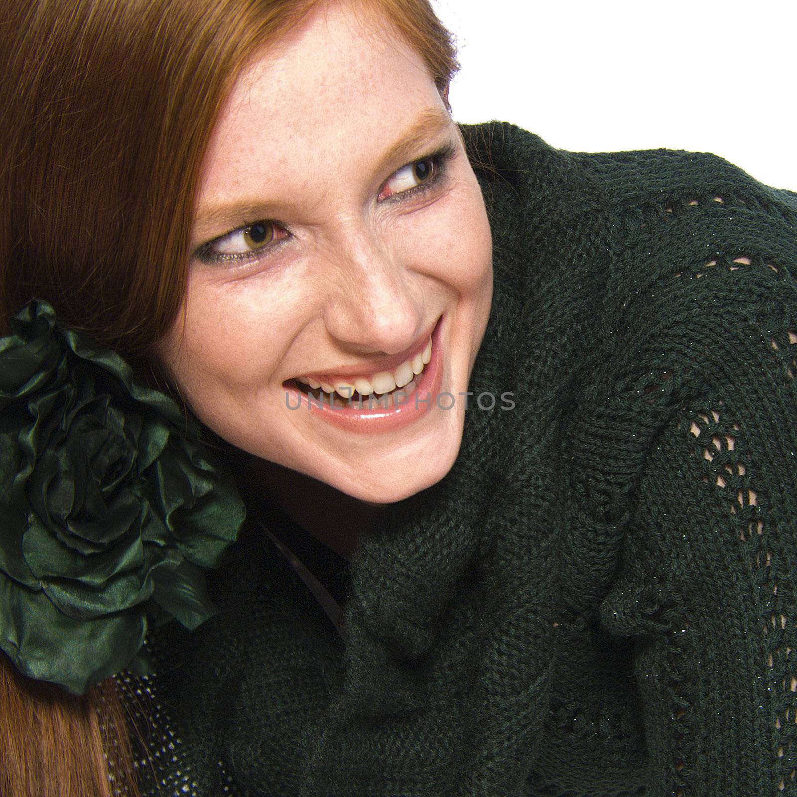 Studio portrait of a natural redhead looking amused