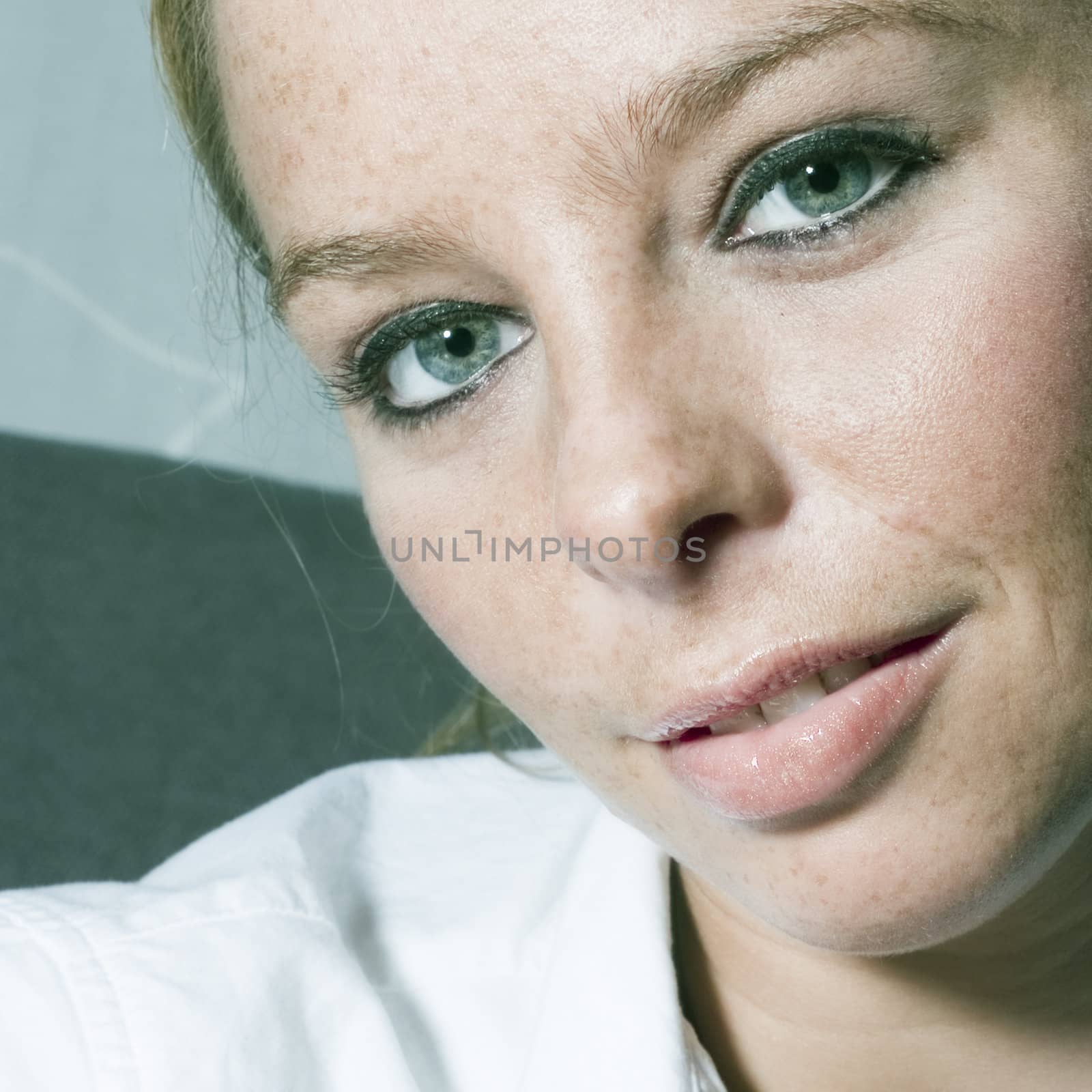 Studio portrait of a beautyfull blond model with green eyes