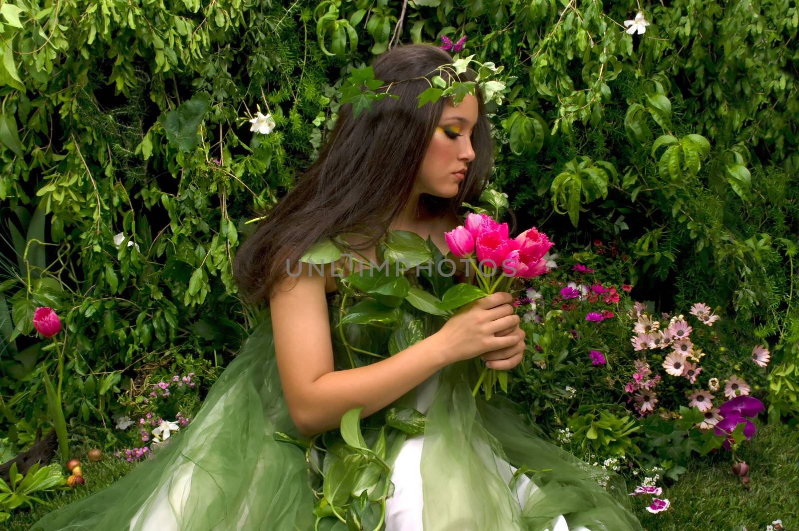 Mother Nature looking upon some of her many beautiful creations in her enchanted garden
This indoor studio shoot is a compilation of many fresh flowers, grass, tree branches and bushes. 

