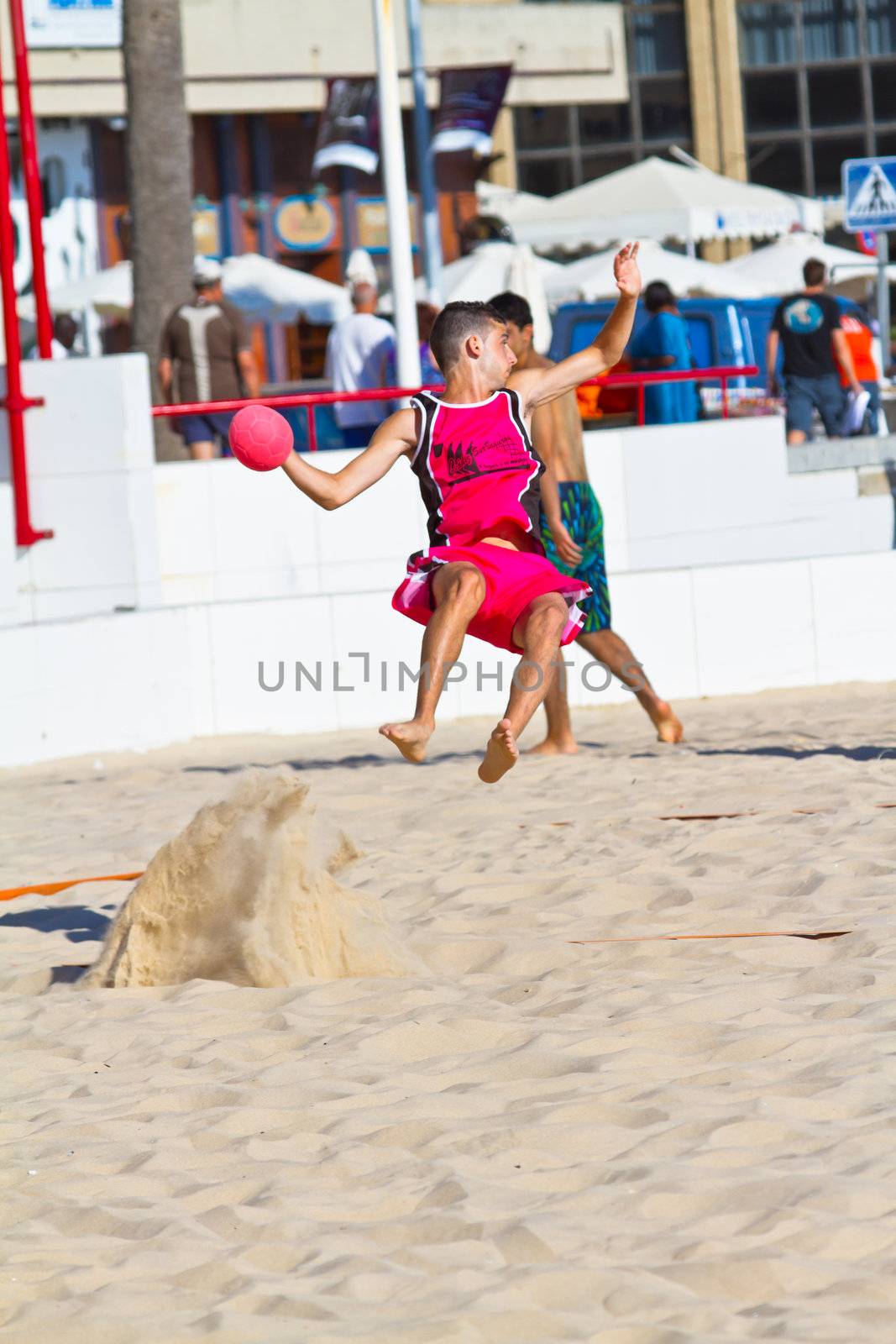 CADIZ, SPAIN - JULY 19: Unidentified players compete in a match between Autoescuela Barquin and CadizSur Seguros BMPY in the 19th league of beach handball of Cadiz on July 19, 2011 in Cadiz, Spain