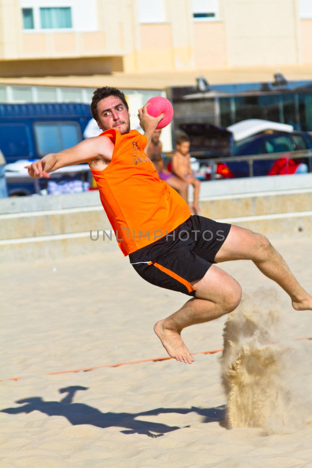 CADIZ, SPAIN - JULY 19: Unidentified players compete in a match between Autoescuela Barquin and CadizSur Seguros BMPY in the 19th league of beach handball of Cadiz on July 19, 2011 in Cadiz, Spain