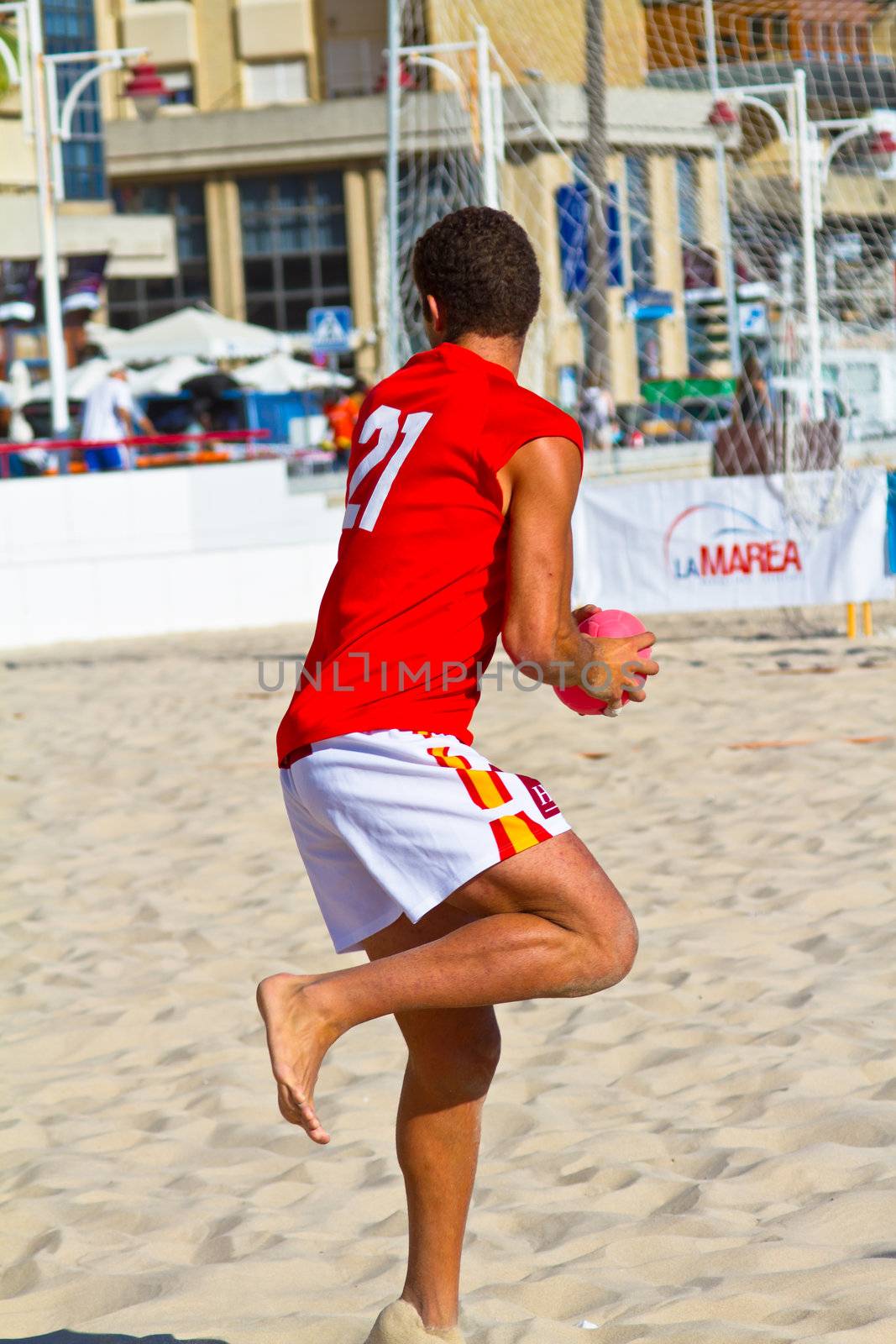 CADIZ, SPAIN - JULY 19: Unidentified players compete in a match between Autoescuela Barquin and CadizSur Seguros BMPY in the 19th league of beach handball of Cadiz on July 19, 2011 in Cadiz, Spain