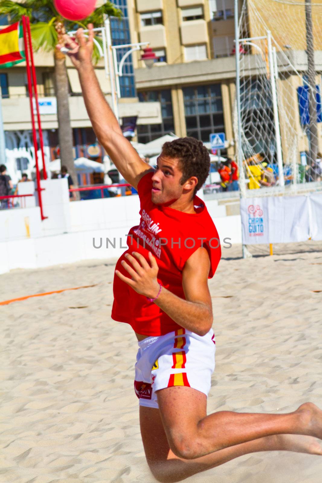 CADIZ, SPAIN - JULY 19: Unidentified players compete in a match between Autoescuela Barquin and CadizSur Seguros BMPY in the 19th league of beach handball of Cadiz on July 19, 2011 in Cadiz, Spain