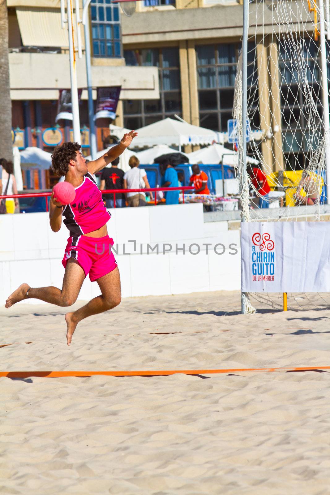 CADIZ, SPAIN - JULY 19: Unidentified players compete in a match between Autoescuela Barquin and CadizSur Seguros BMPY in the 19th league of beach handball of Cadiz on July 19, 2011 in Cadiz, Spain