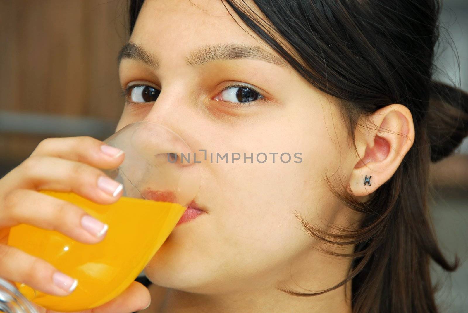 Girl portrait drinking juice by simply