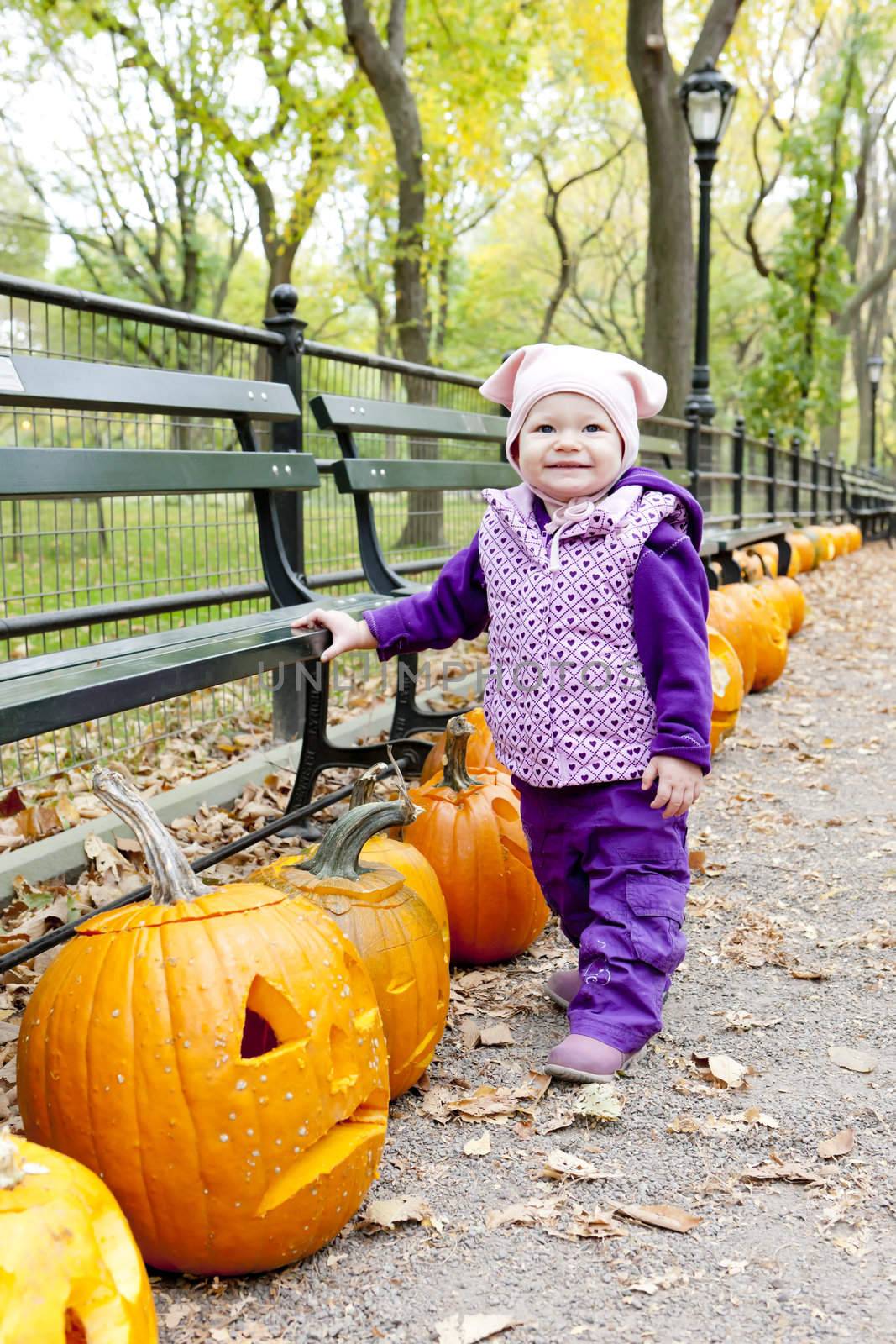 little girl in autumnal Central Park, New York City, USA