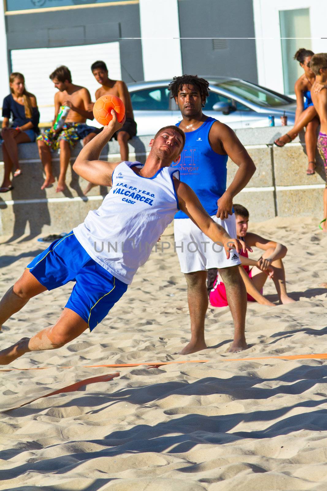 CADIZ, SPAIN - JULY 19: Unidentified players compete in a match between Valcarcel Recuperado and DecoHogar in the 19th league of beach handball of Cadiz on July 19, 2011 in Cadiz, Spain