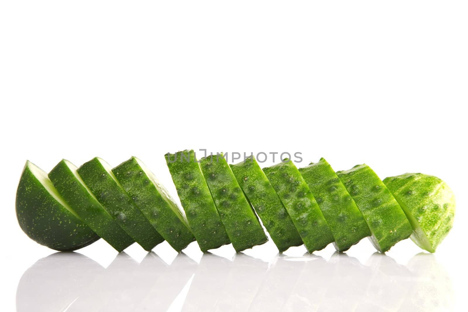 front view of cucumber slices isolated on white