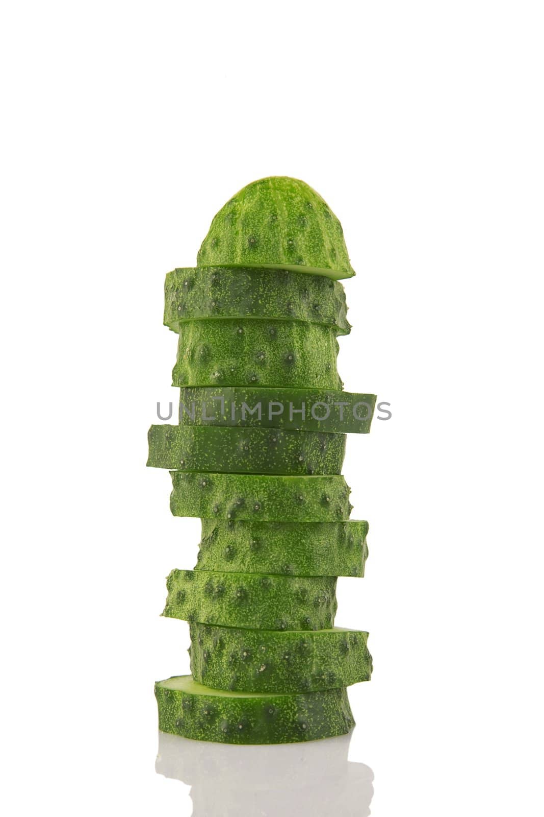 pile of cucumber slices isolated on a white background