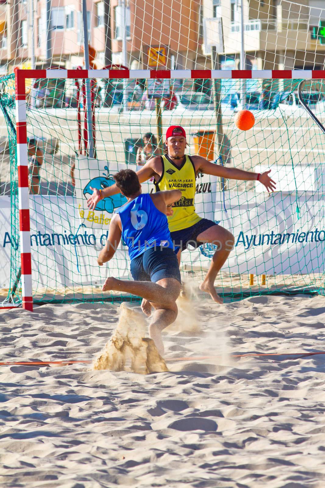 CADIZ, SPAIN - JULY 19: Unidentified players compete in a match between Valcarcel Recuperado and DecoHogar in the 19th league of beach handball of Cadiz on July 19, 2011 in Cadiz, Spain