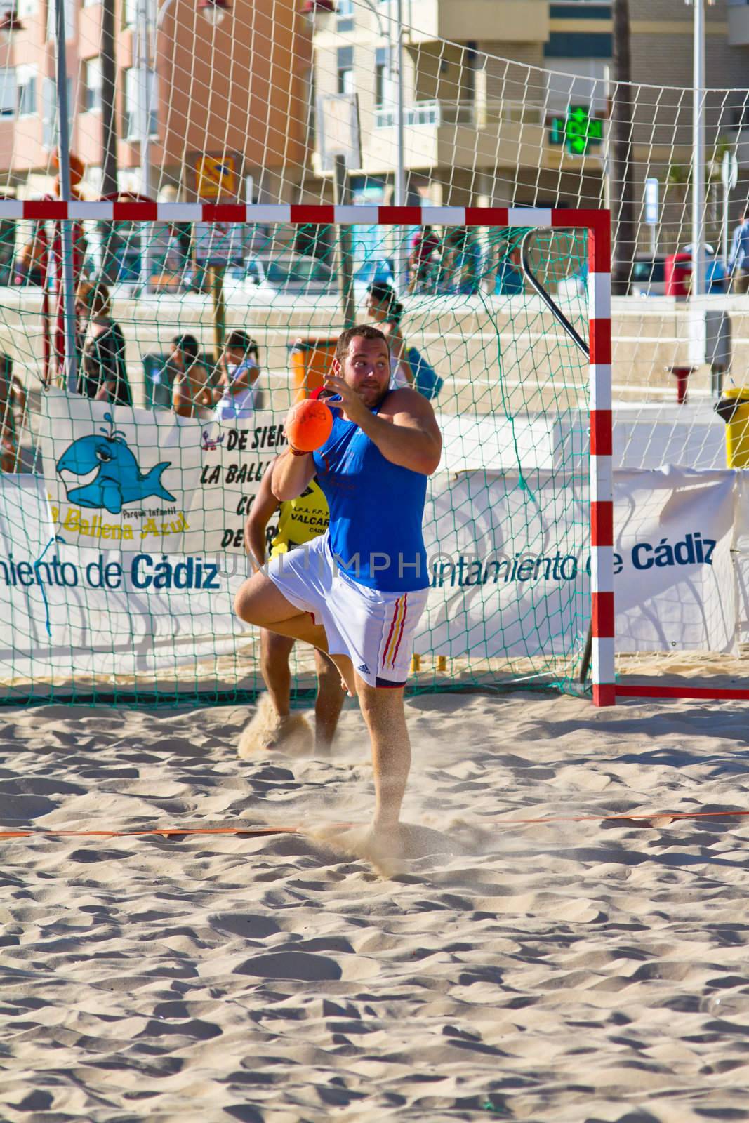 CADIZ, SPAIN - JULY 19: Unidentified players compete in a match between Valcarcel Recuperado and DecoHogar in the 19th league of beach handball of Cadiz on July 19, 2011 in Cadiz, Spain