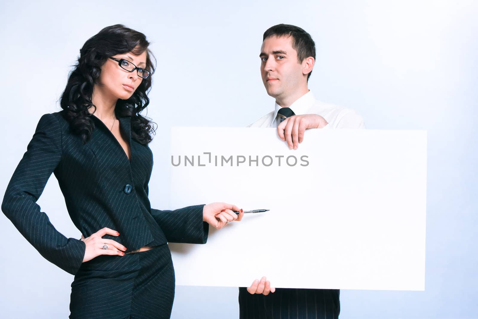 Portrait of business man and business woman with an empty billboard