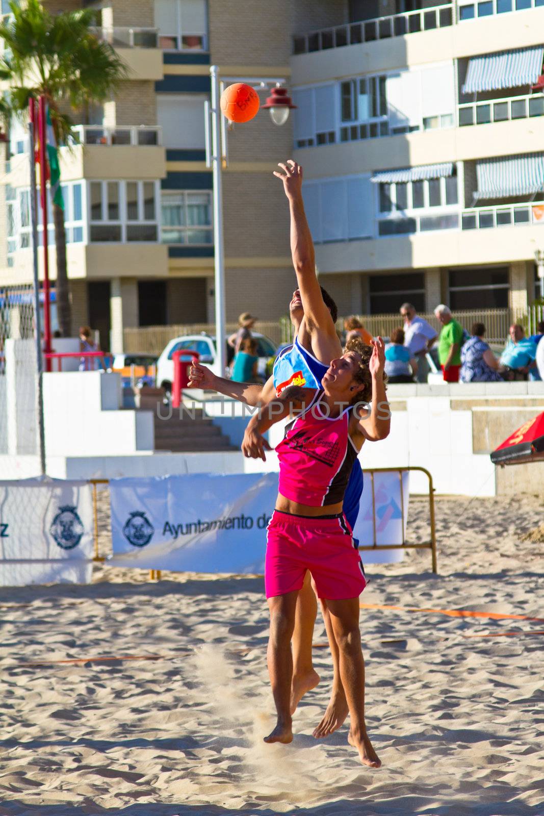 CADIZ, SPAIN - JULY 19: Unidentified players compete in a match between Zonabalonmano.com and CadizSur Seguros BMPY in the 19th league of beach handball of Cadiz on July 19, 2011 in Cadiz, Spain