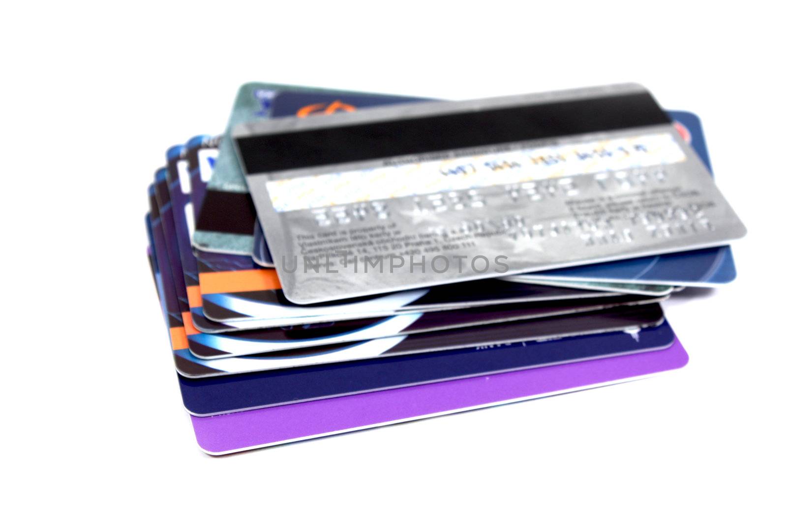 Stack of credit cards on white background
