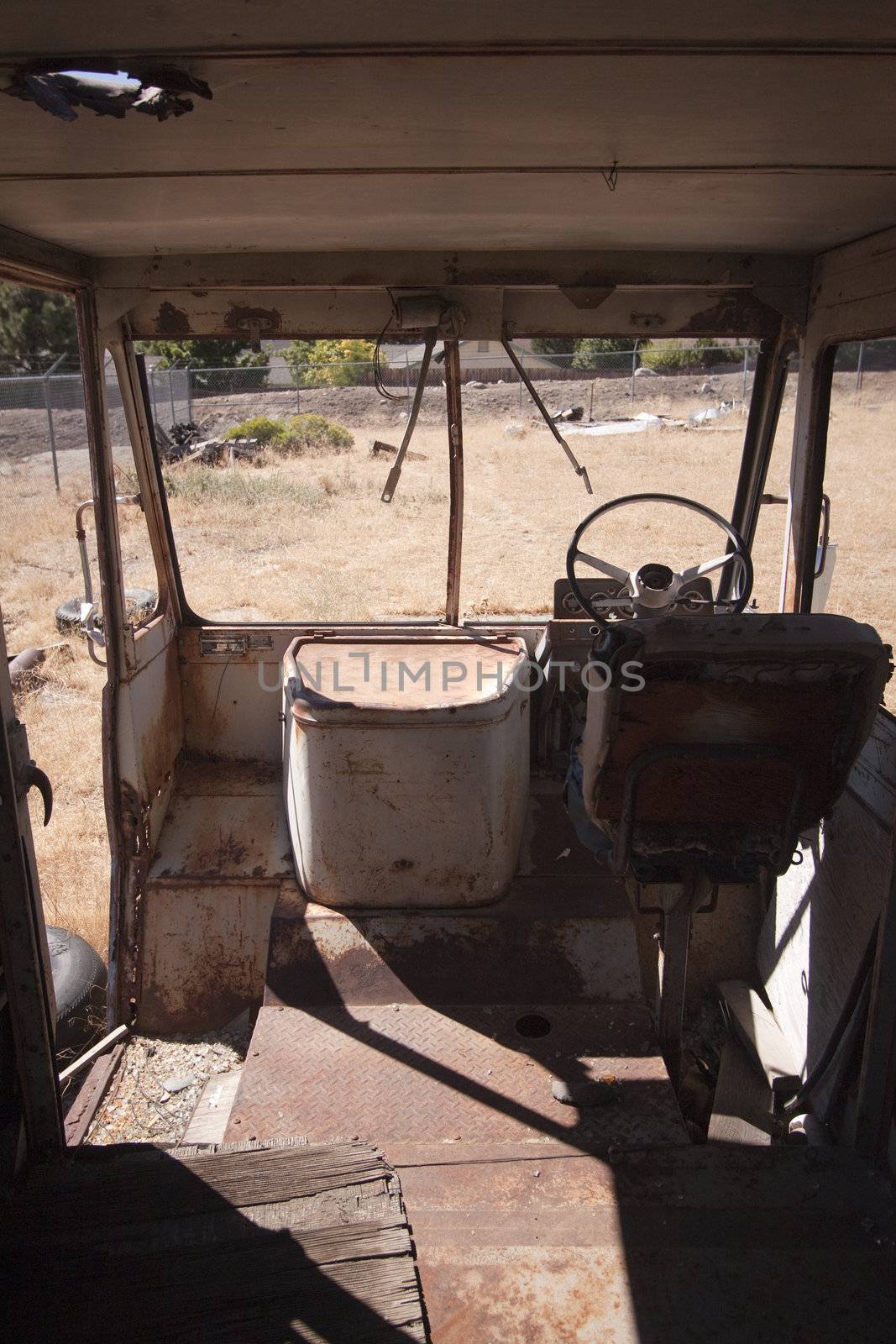 An old abandoned vintage delivery truck van in a field by jeremywhat