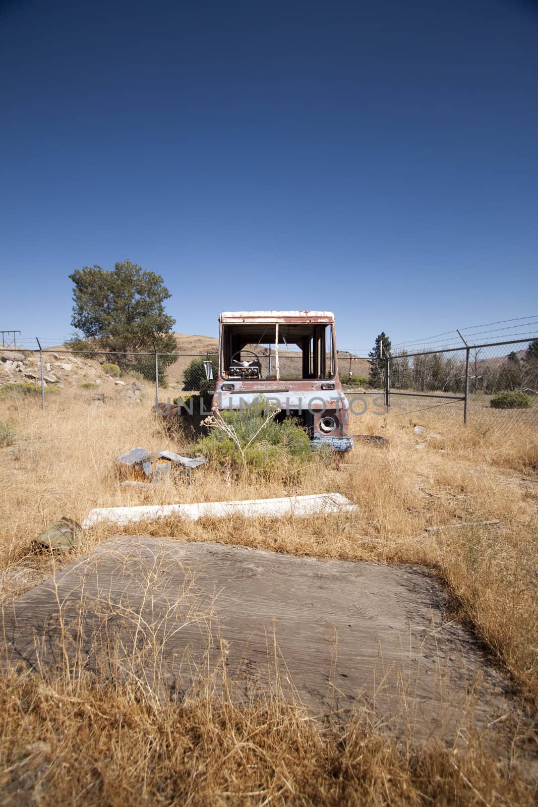 An old rusty abandoned car.