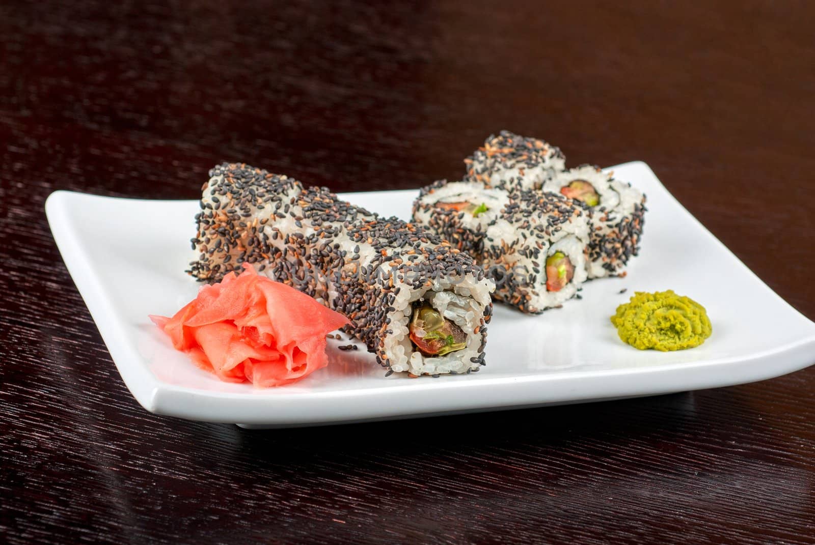 Closeup of Sushi rolls at plate with sesame