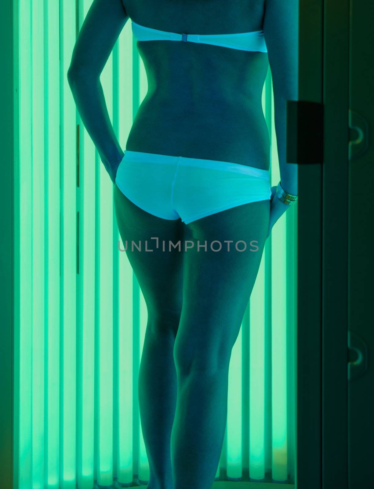 beautiful girl closeup in swimsuit at solarium