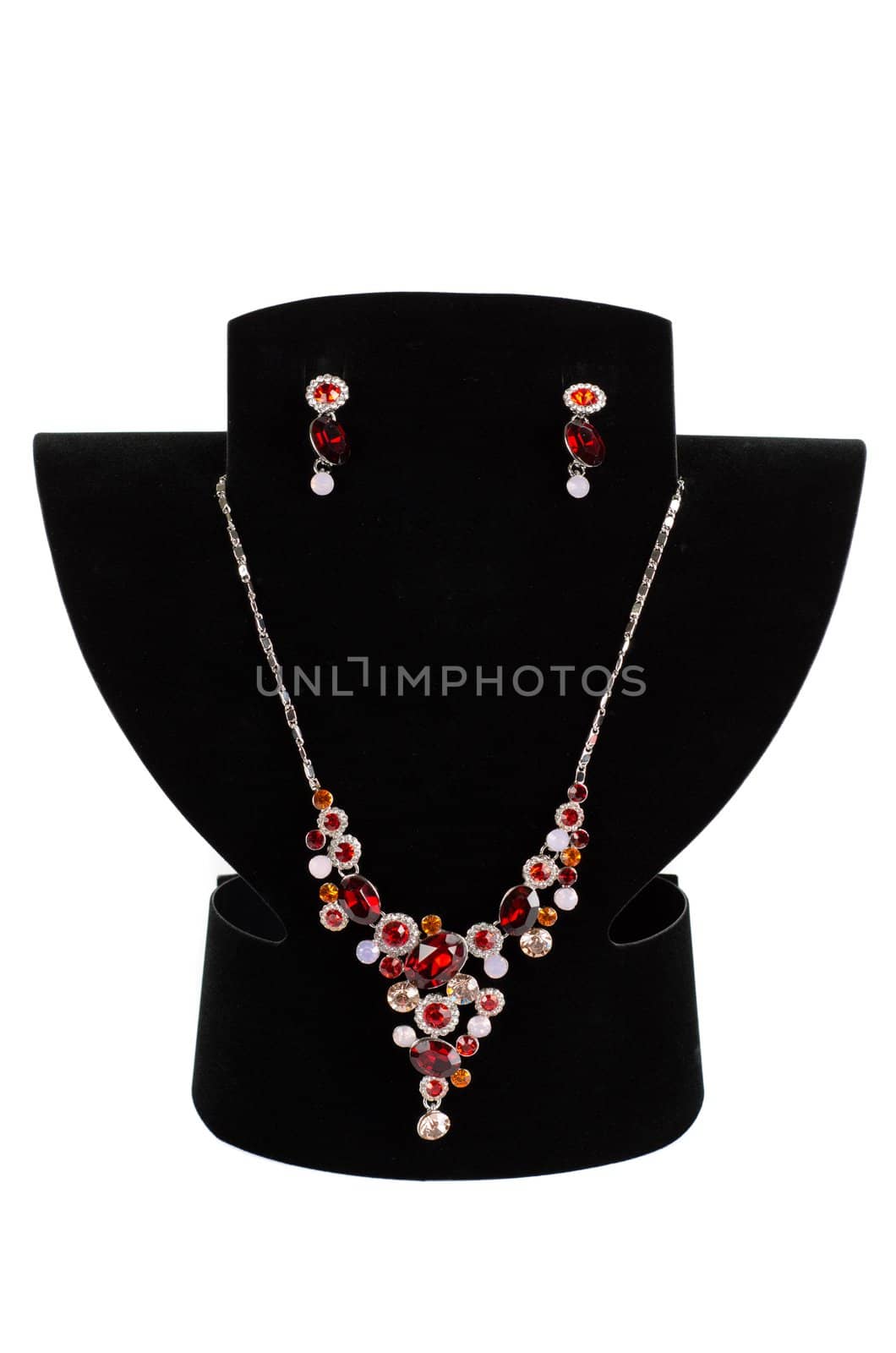 a necklace with pendants and earrings on a white background