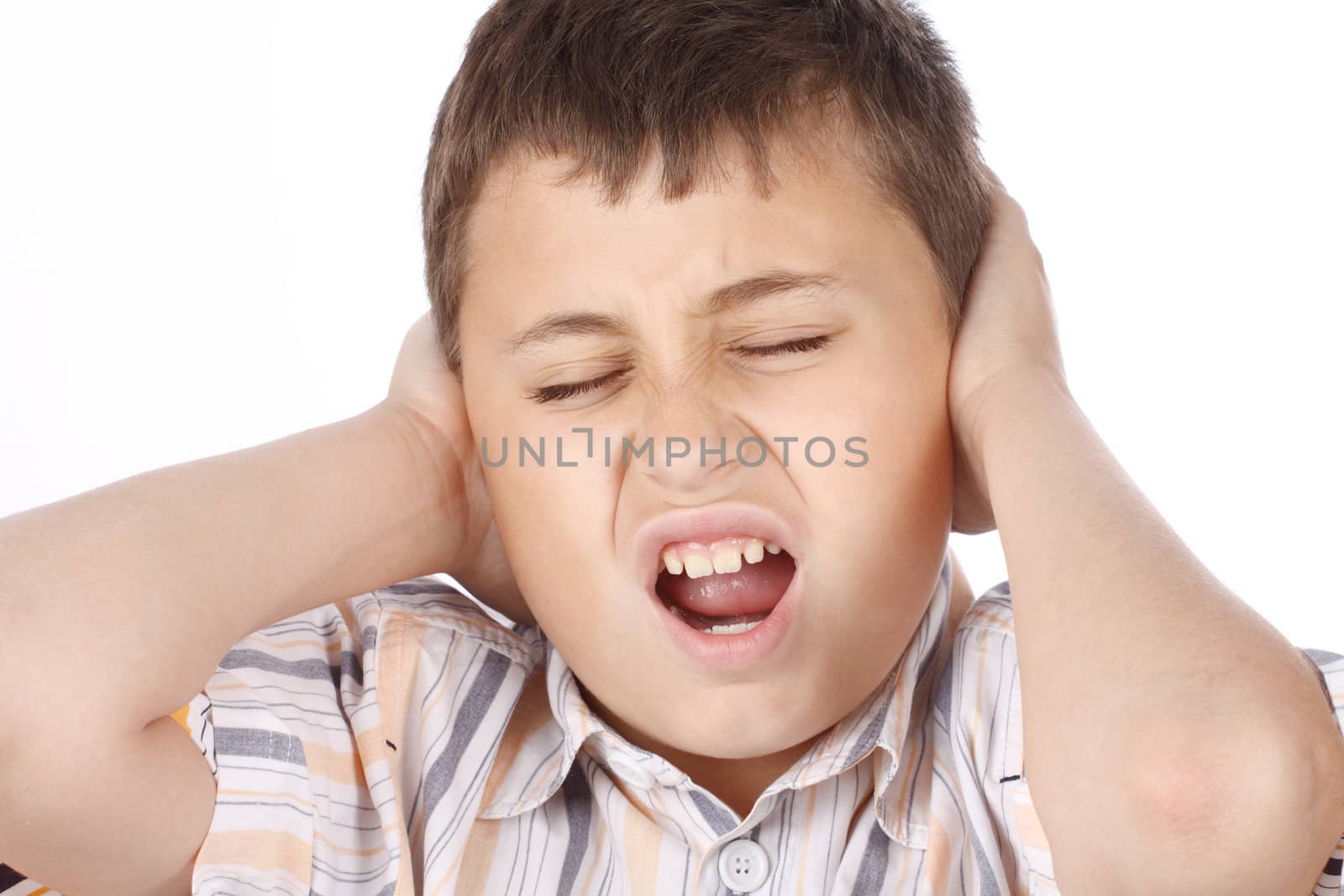 Close up of screaming boy over white