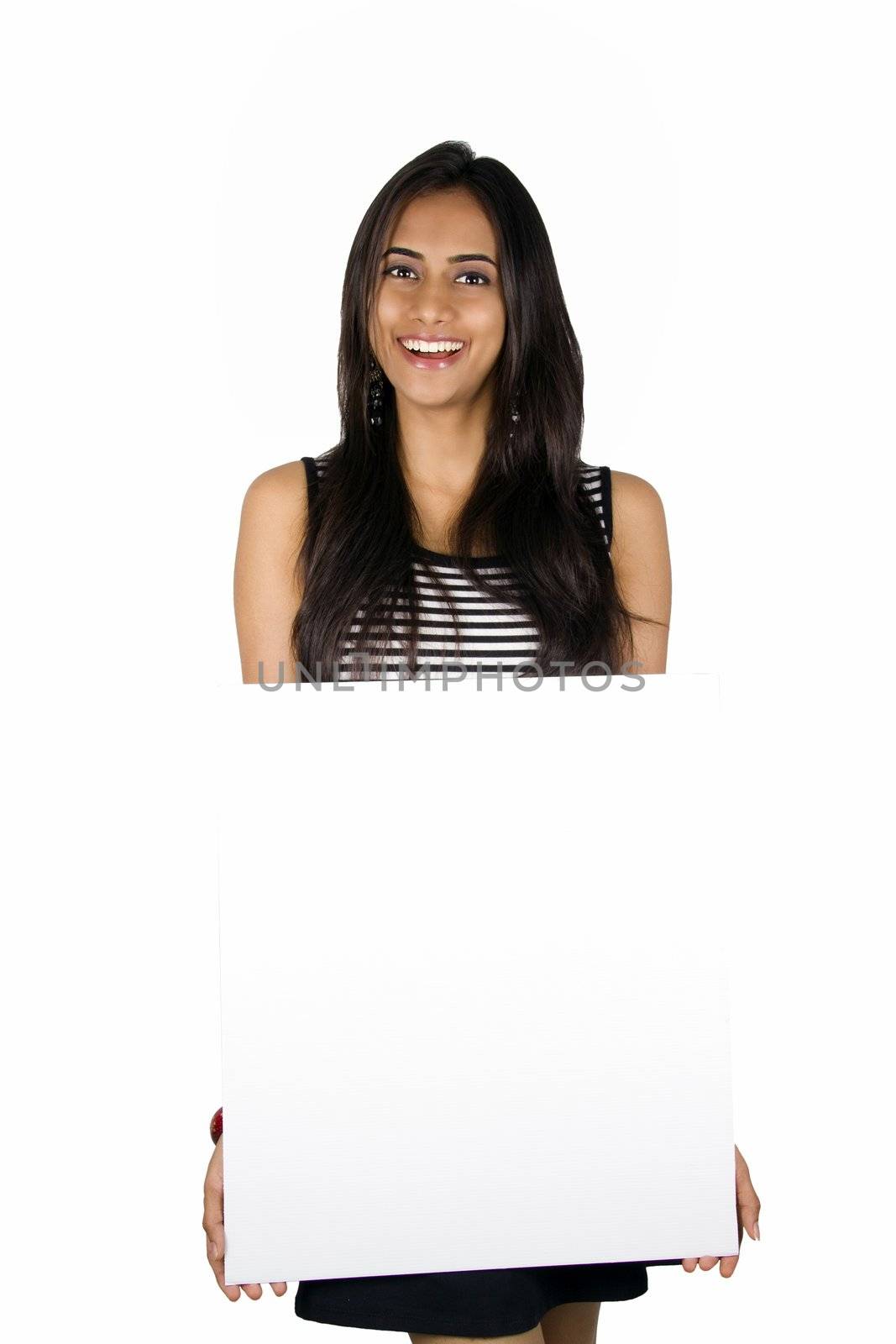 Beautiful Indian girl holding a white board.. Isolated on a white background.