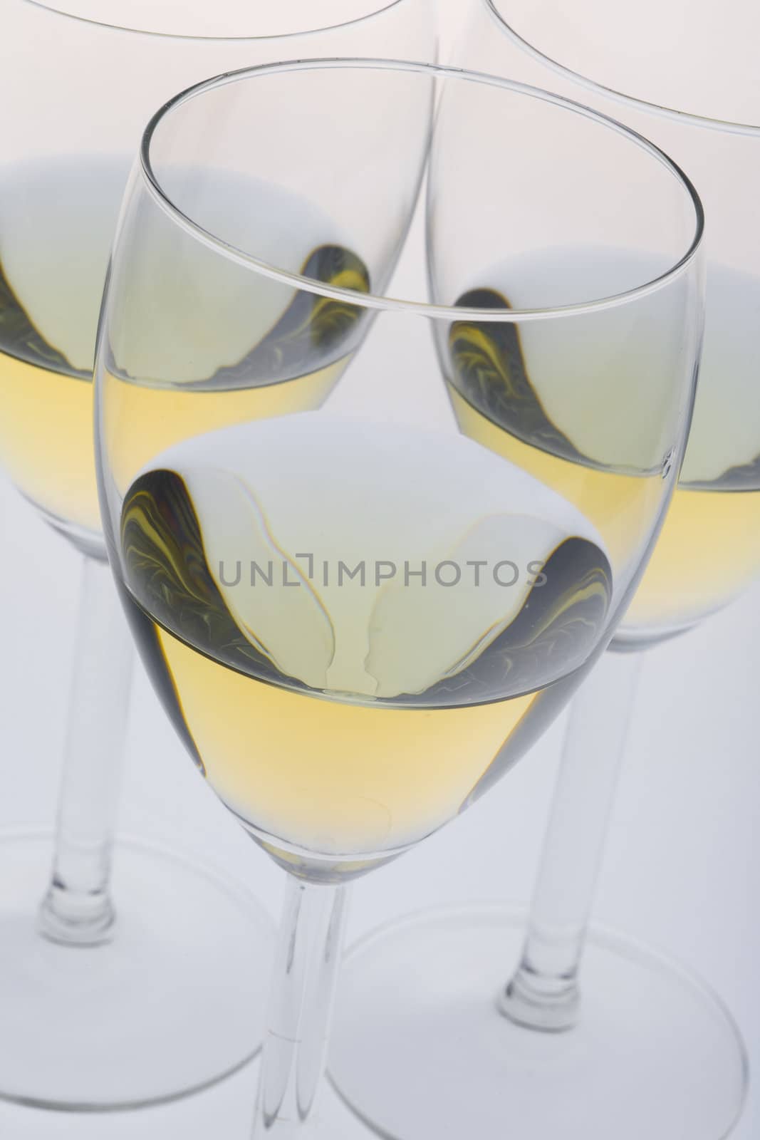 wineglasses with white wine by phbcz