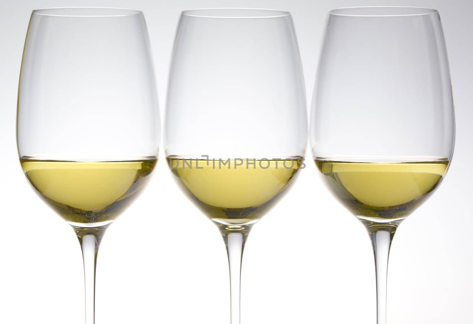 wineglasses with white wine by phbcz