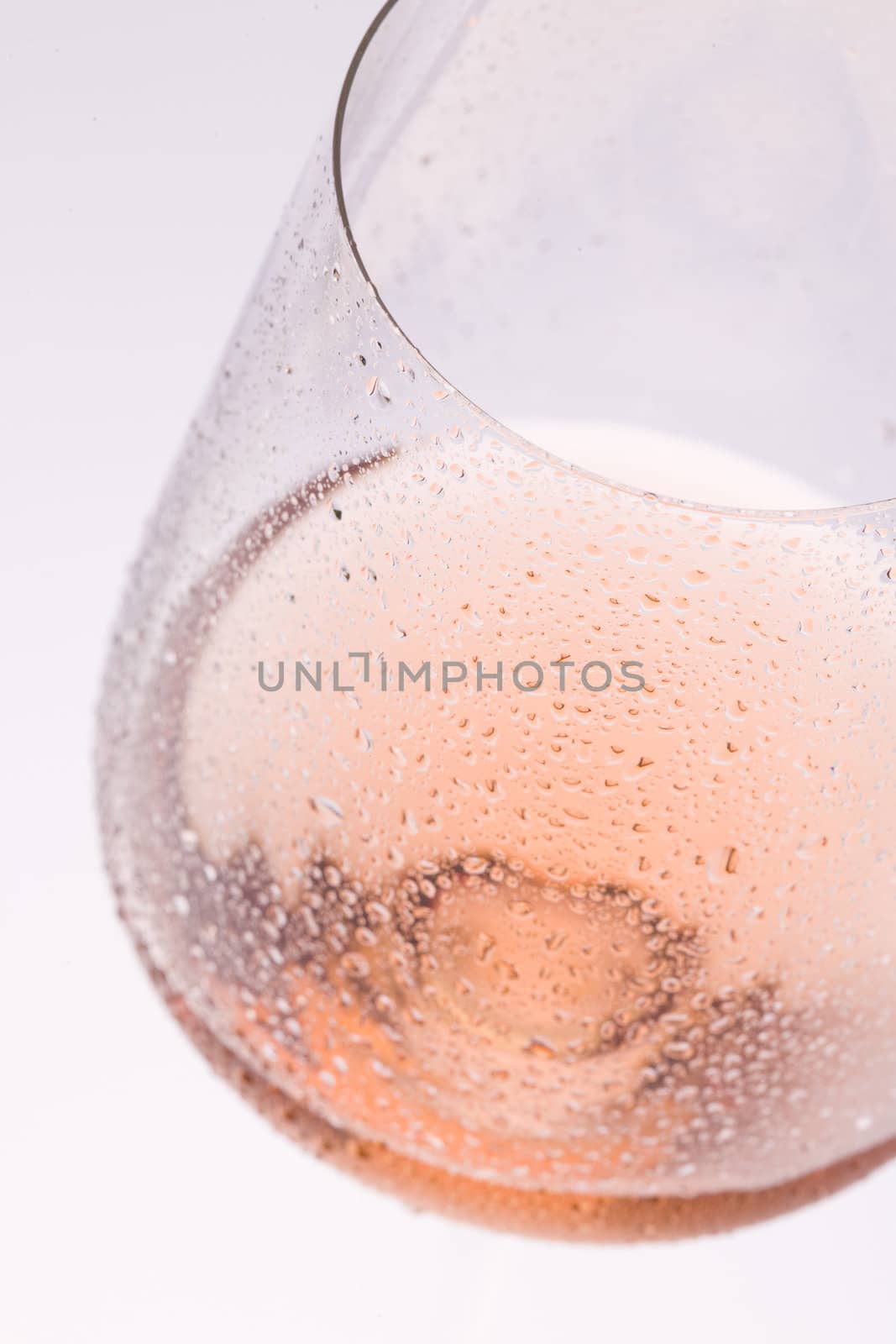 wineglass with ros� wine by phbcz